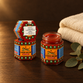Tiger Balsam Gosok Merah 30g – Dose geöffnet mit Handtuch
